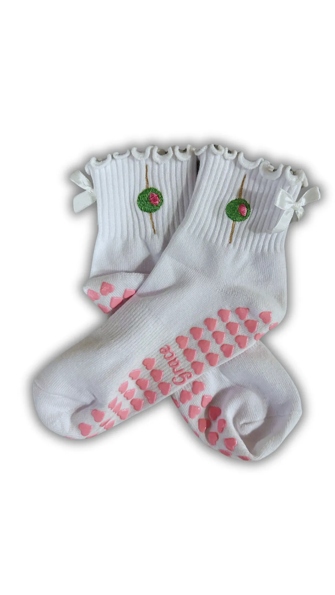 White ruffle olive grip sock with white bow and pink heart grips